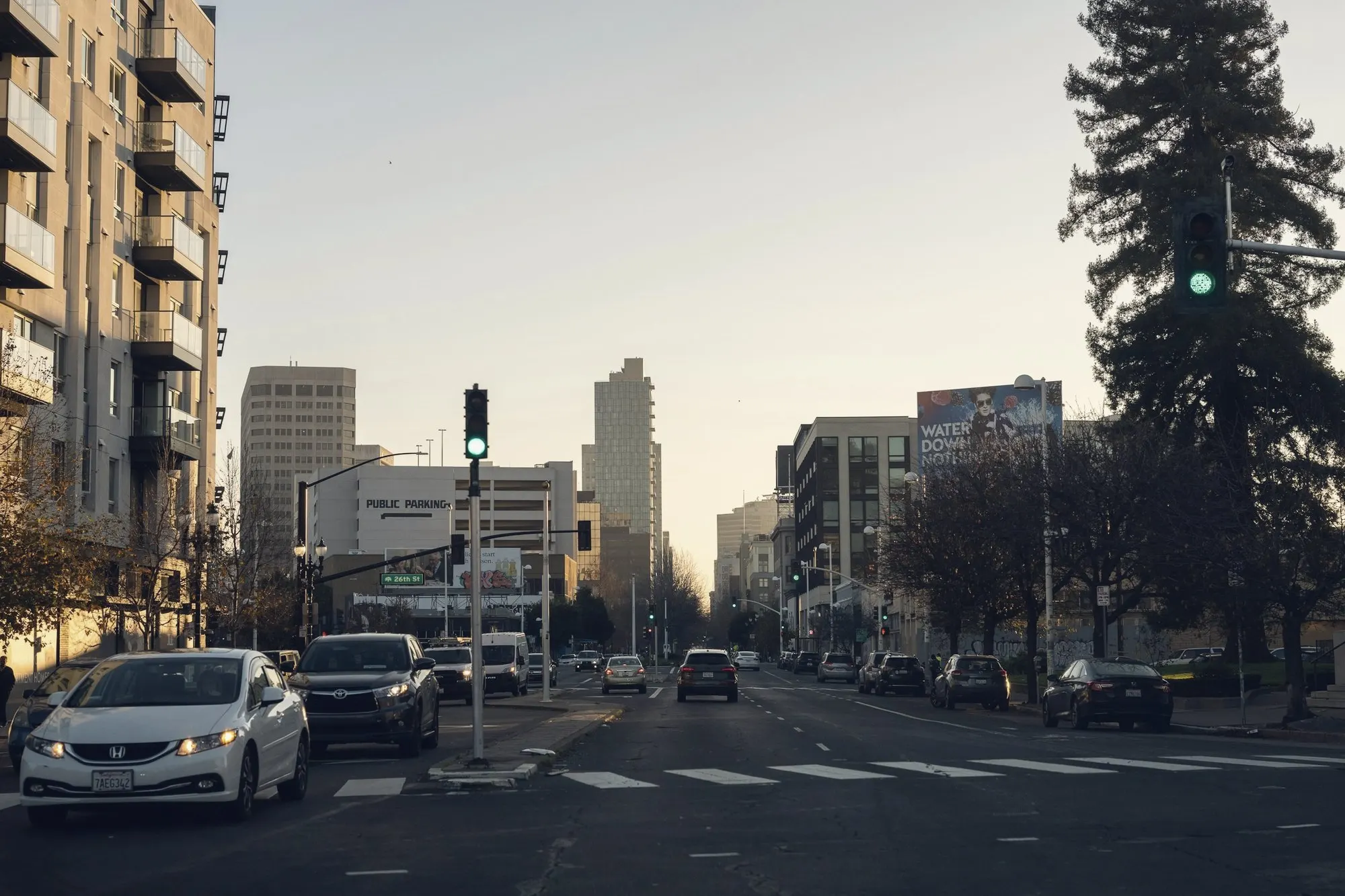 Downtown Oakland street with office towers and traffic